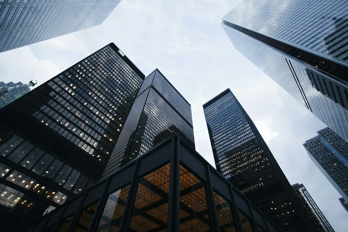 Glass facade of modern financial building representing organized household cash management