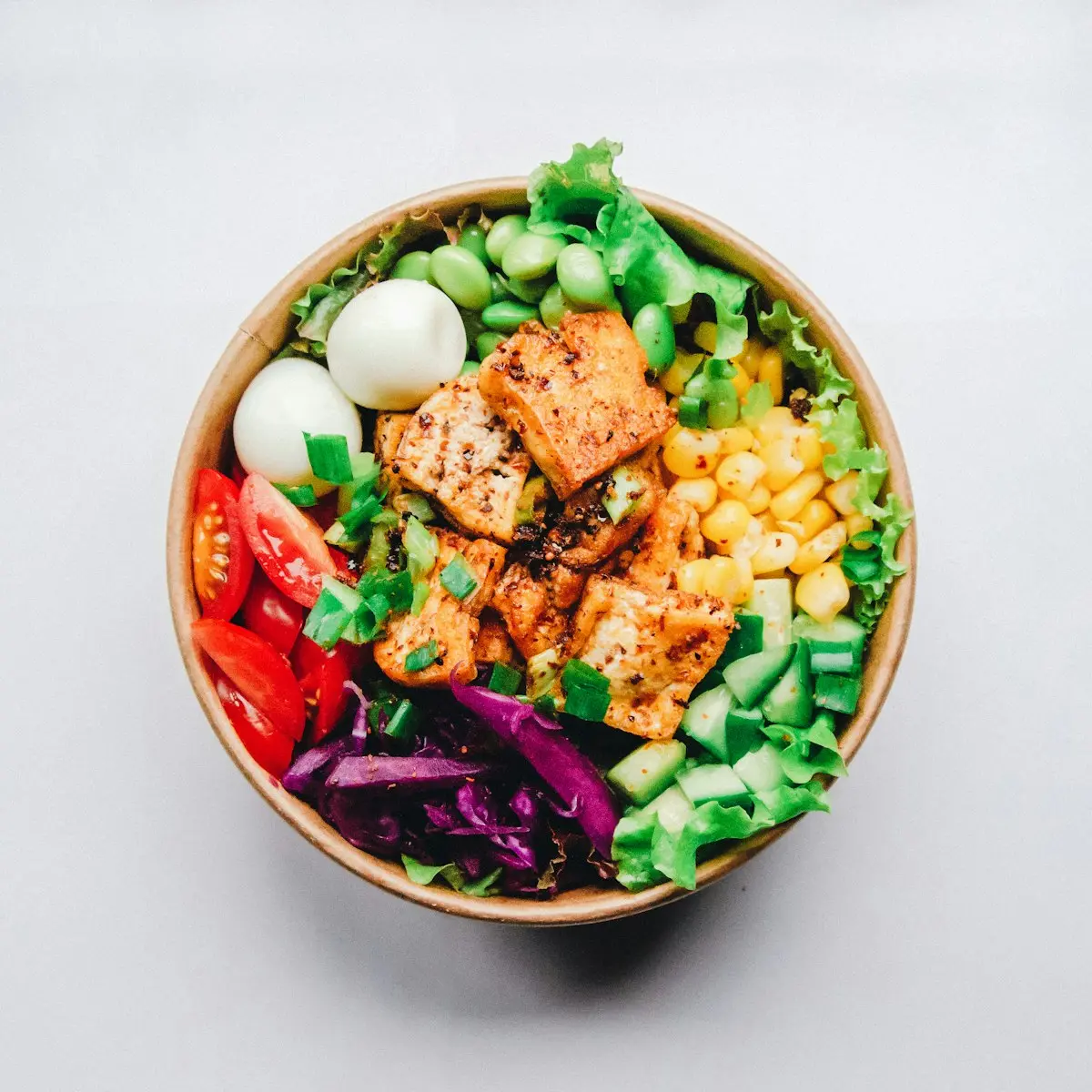 Fresh colorful salad and grain dinner bowl prepared at home using basic pantry staples