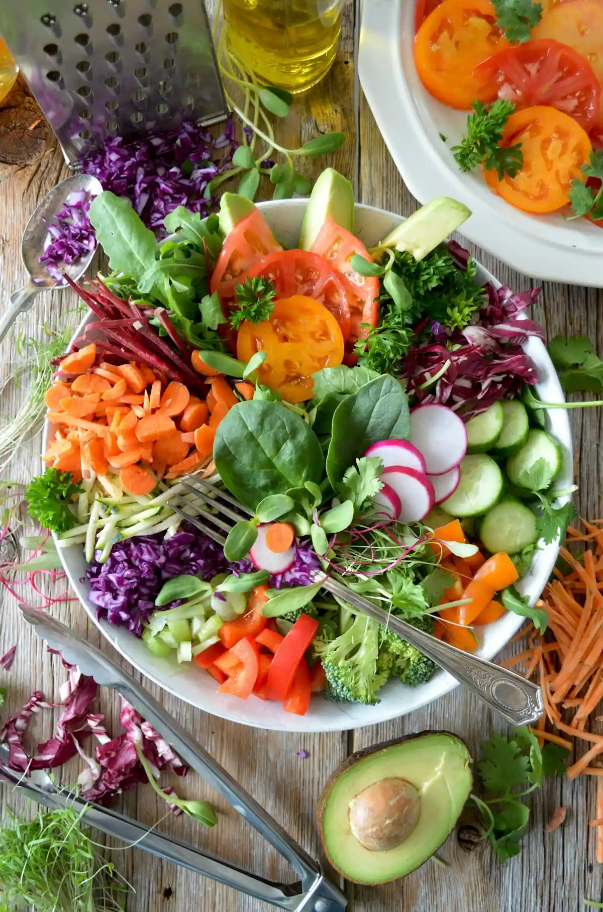 Crisp green organic vegetables organized inside specialized vented produce keeper containers